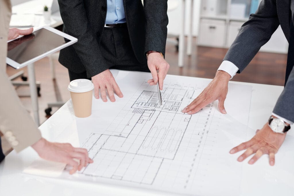 nybyg - Nybyg - Nørgaard Byg ApS - business people discussing floor plans 2021 09 24 02 47 58 utc